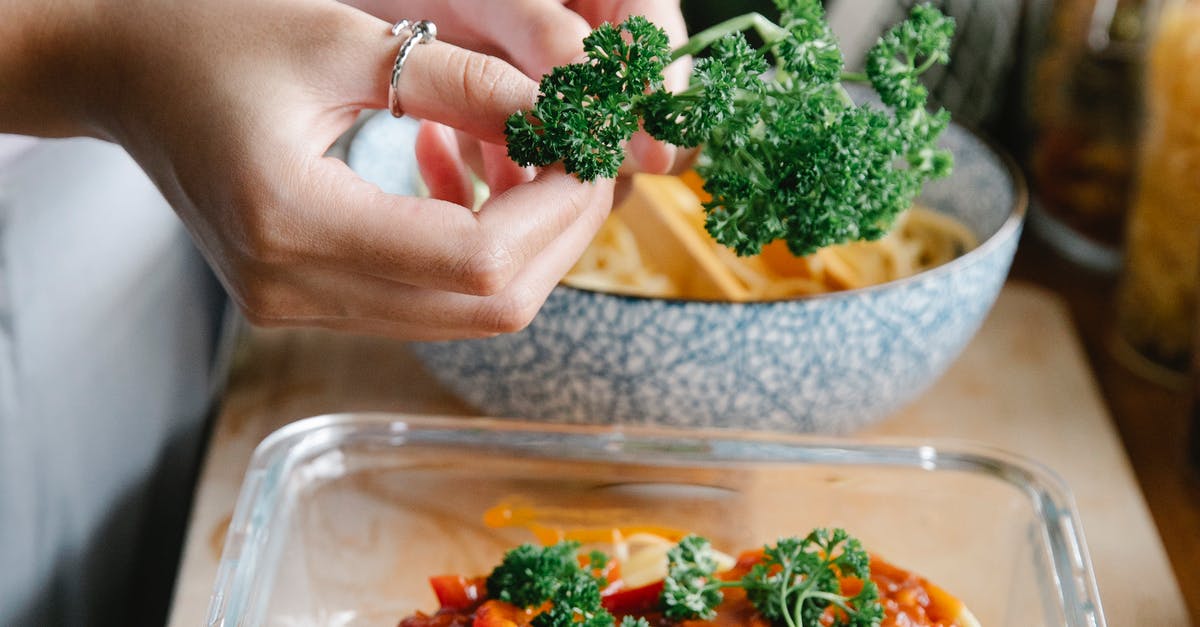A person holding a plate of food with broccoli