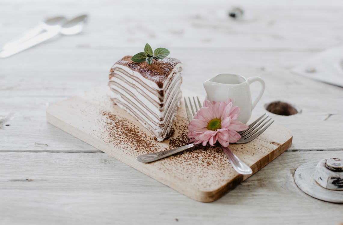 A piece of cake sitting on top of a wooden table