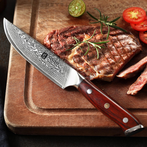 A knife sitting on top of a wooden cutting board
